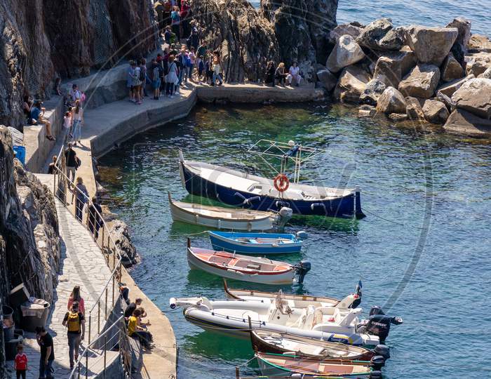 Manarola, Liguria/Italy  - April 20 : Colourful Boats At Manarola Liguria Italy On April 20, 2019. Unidentified People