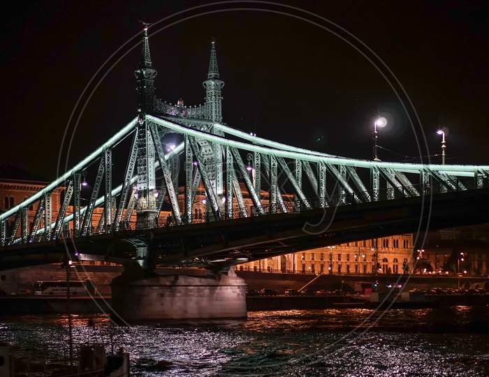 Liberty Bridge Illuminated At Night In Budapest