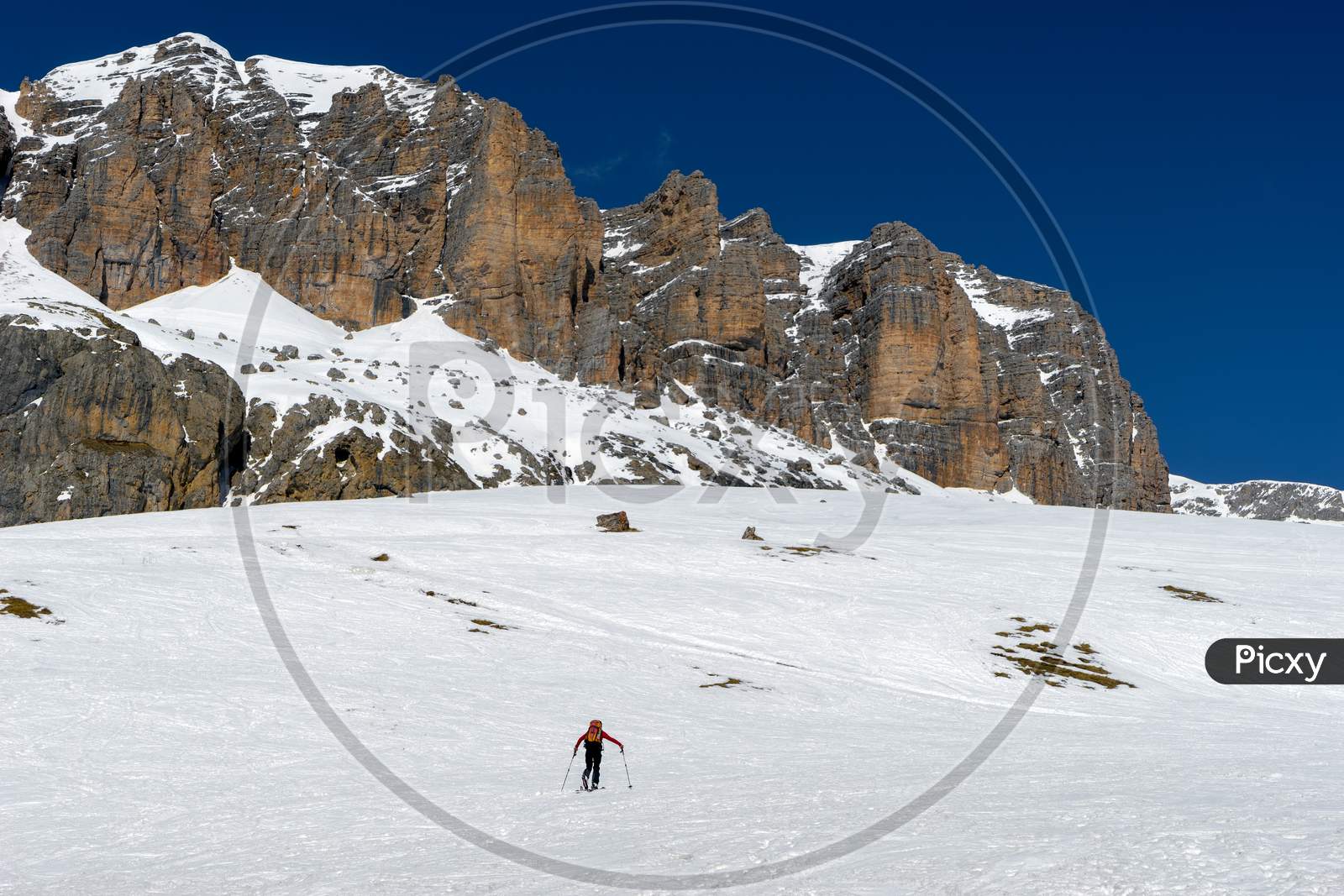 Person Skiing In The Dolomites From The Pordoi Pass