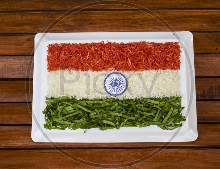 Indian Republic Day Theme Indian Flag Depicted By Food. Salad Of Fresh Raw Grated Carrot, Radish And Spinach.