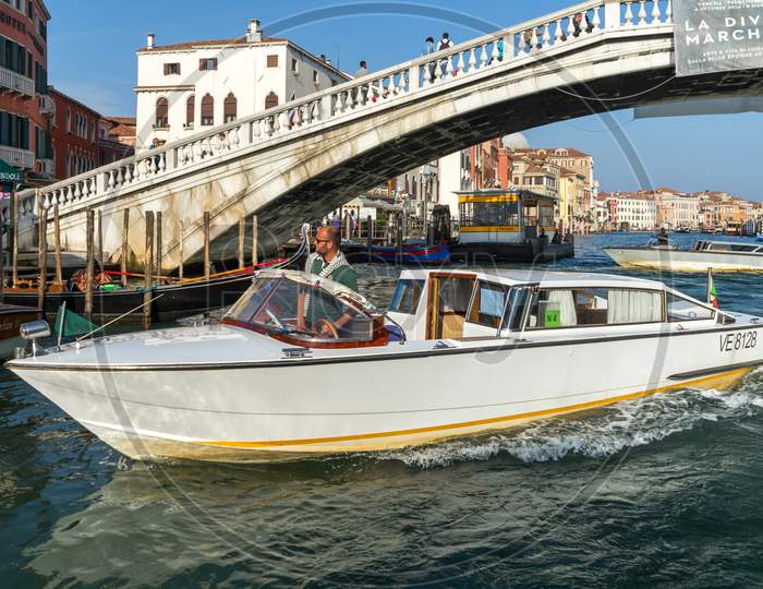 Motorboat Cruising Down The Grand Canal In Venice