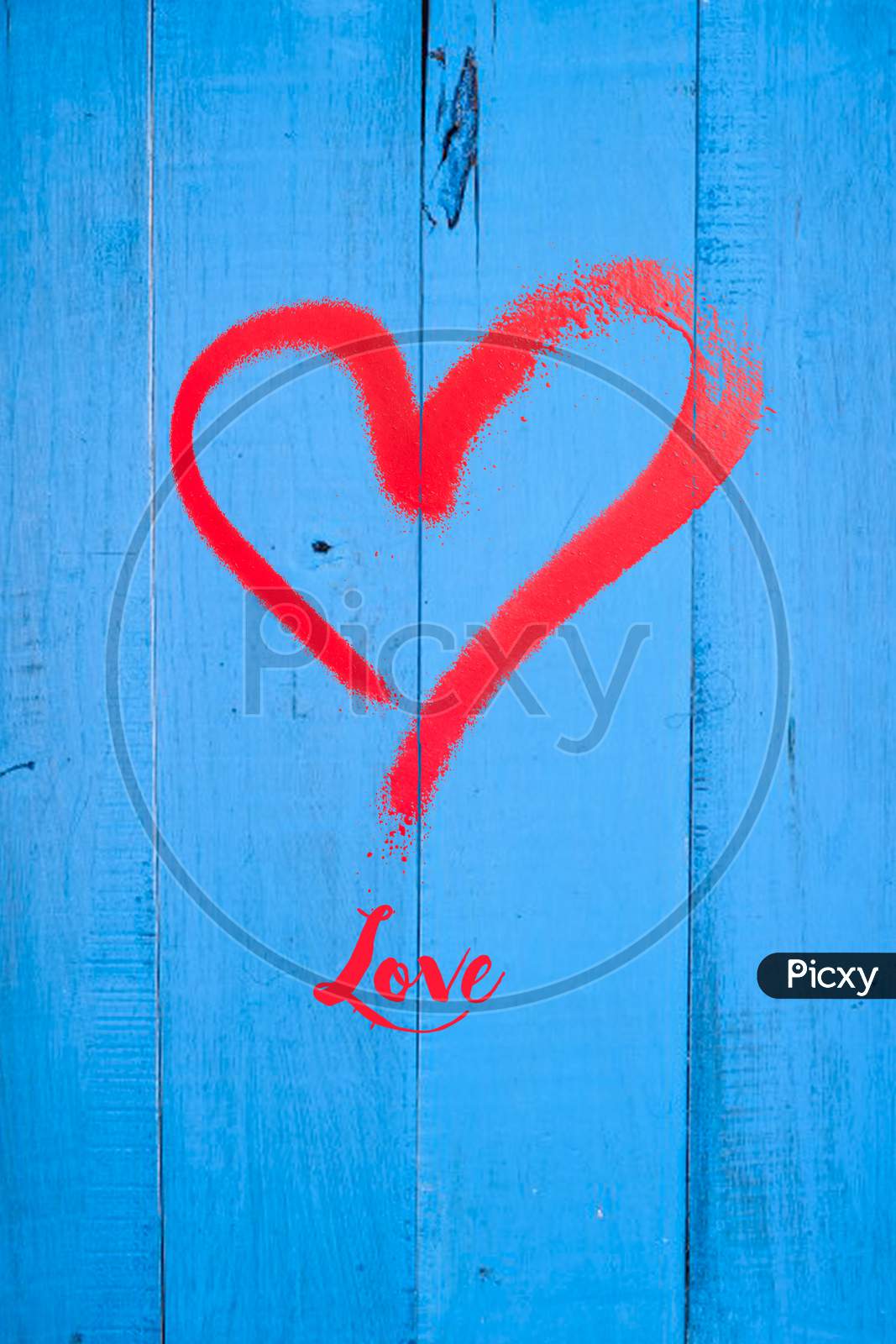 Love And Heart Stamp On Blue Wooden Background