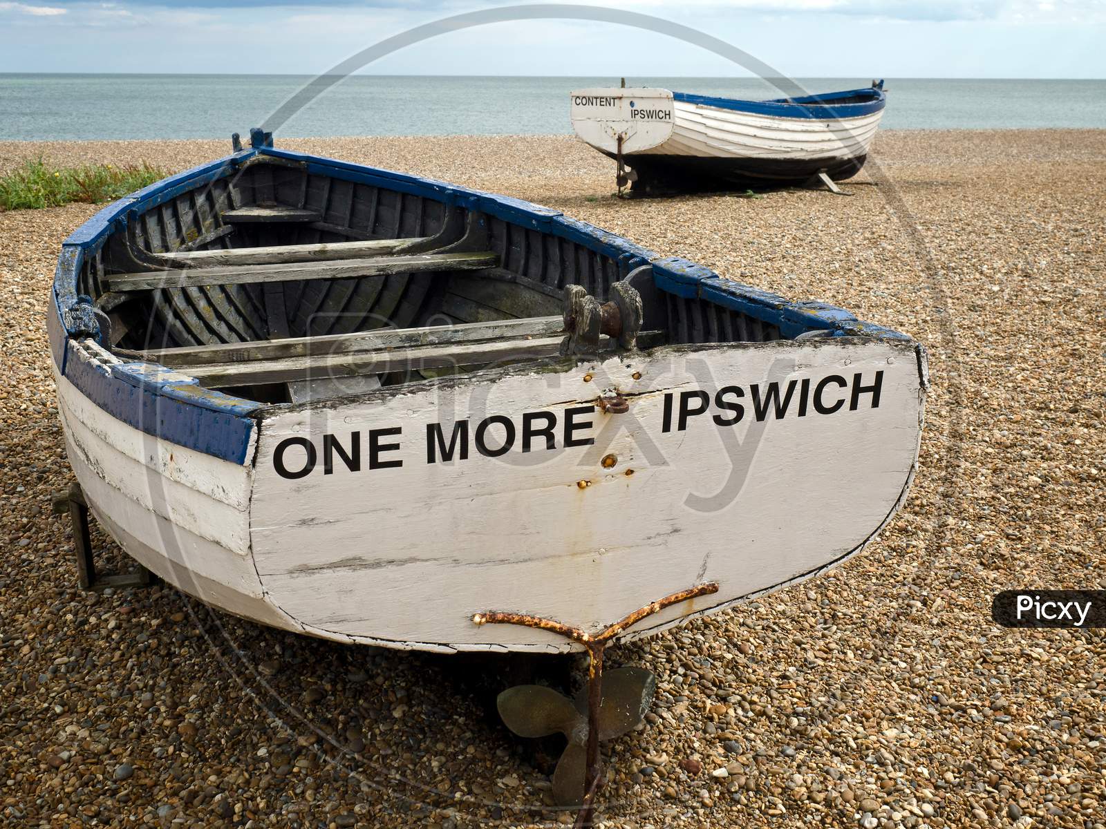 Close shot of fishing rowing boat on Aldeburgh beach sea in