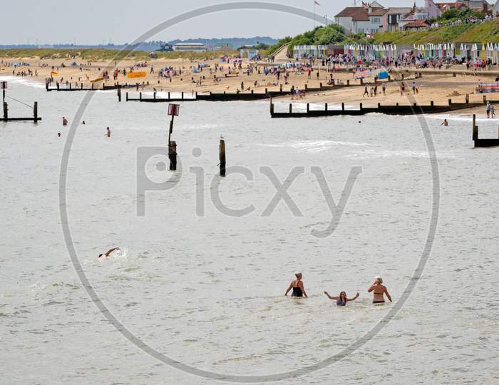 People Enjoying The Beach At Southwold