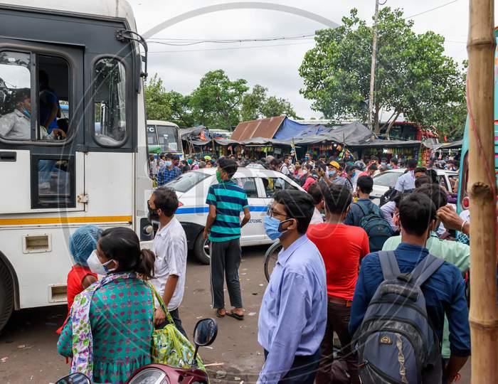 People Gathered In The Bus Stand Waiting For The Bus With Masks During Unlock Period In Kolkata, West Bengal, India On October 2020
