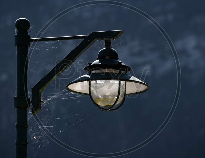 Spiders Web Attached To A Lamppost In Hallstatt