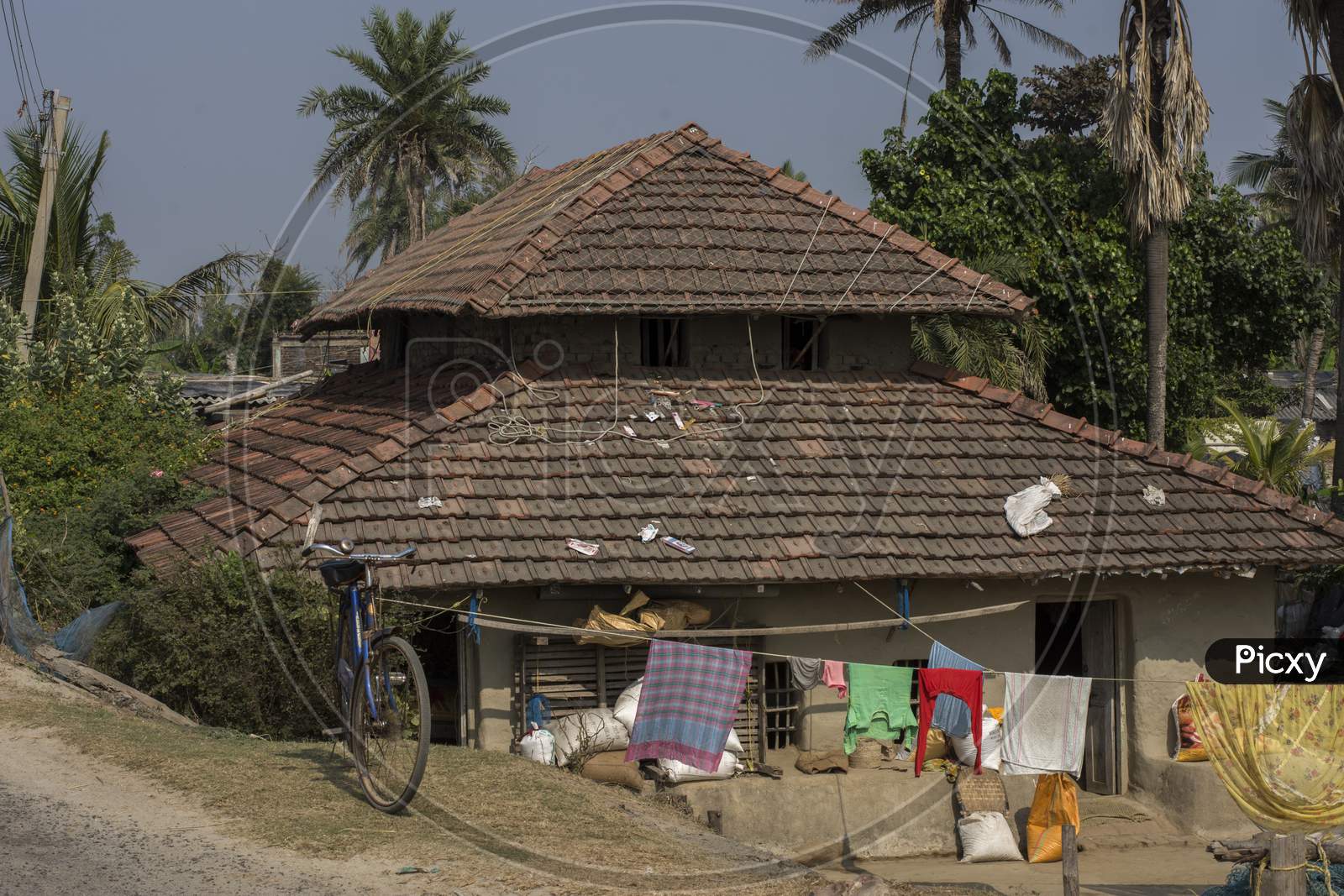 A Small Indian Village House Made With Clay And Roof Tiles.