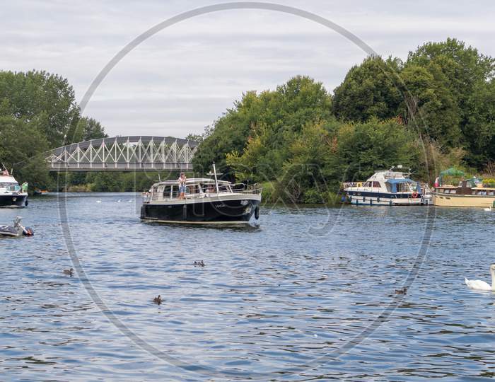 Windsor, Maidenhead & Windsor/Uk - July 22 : Boats Cruising Down The River Thames At Windsor, Maidenhead & Windsor On July 22, 2018. Unidentified People