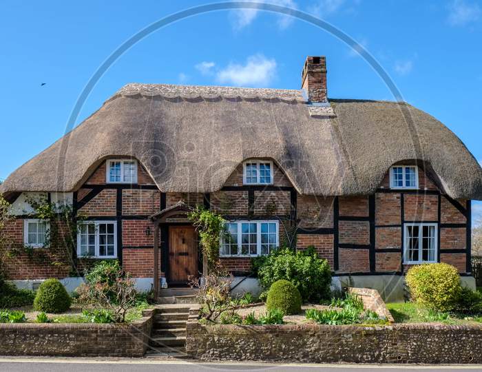 View Of A Thatched Cottage In Micheldever Hampshire