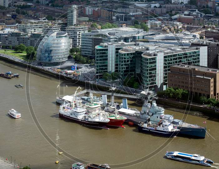 Hms Belfast And Other Boats Moored In The Thames