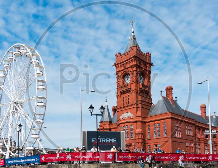 Cardiff/Uk - August 27 : Ferris Wheel And Pierhead Building In Cardiff On August 27, 2017. Unidentified People