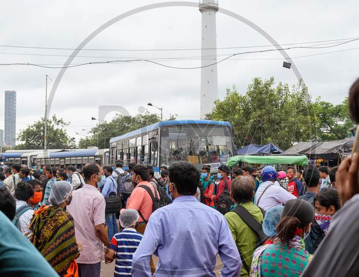People Gathered In The Bus Stand Waiting For The Bus With Masks During Unlock Period In Kolkata, West Bengal, India On October 2020