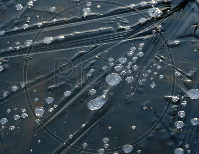 Bubbles Frozen In An Iced Over Lake