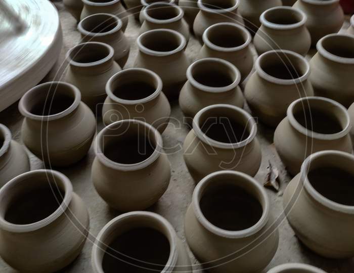Indian Potter making clay products.