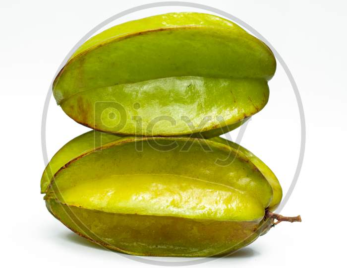 Two Green Carambola Fruit On A White Bg