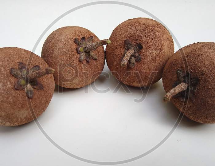 Manilkara zapota (sapodilla ) or sapota fruits on white background
