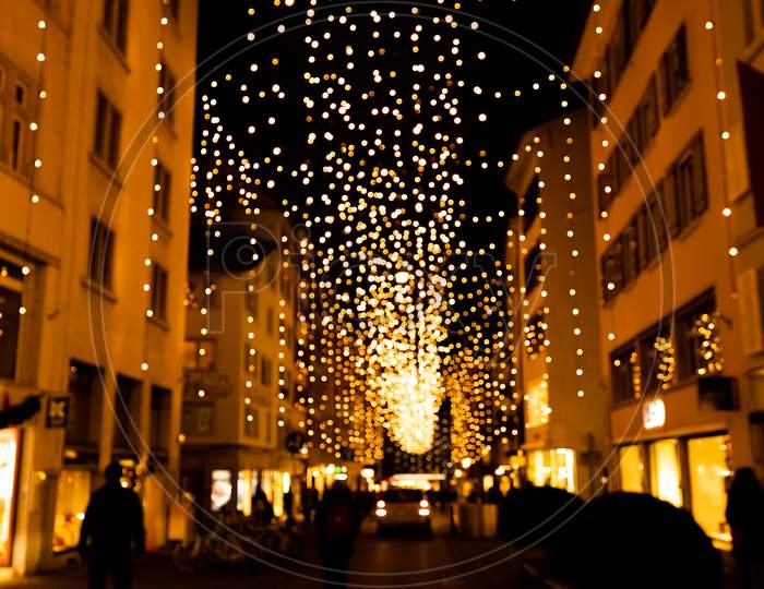 Abstract Blurred Christmas Lights Called Lucy On Side Street Of Bahnhofstrasse In Zurich.