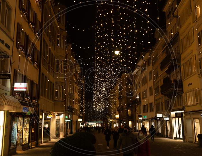 Christmas Shopping Under Traditional Christmas Lights Lucy In Side Street Rennweg In Zurich.