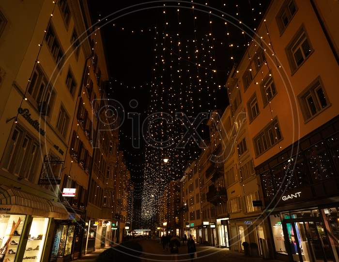 Christmas Shopping Under Traditional Christmas Lights Lucy In Side Street Rennweg In Zurich.