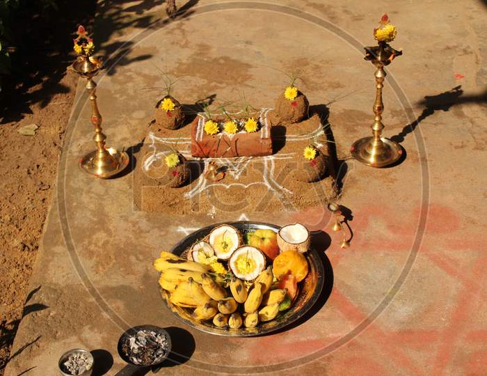 Celebrating Traditional Thai Pongal Festival To Sun God With Pot, Lamp,Wood Fire Stove, Fruits And Sugarcane