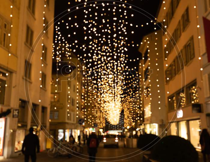 Abstract Blurred Christmas Lights Called Lucy On Side Street Of Bahnhofstrasse In Zurich.