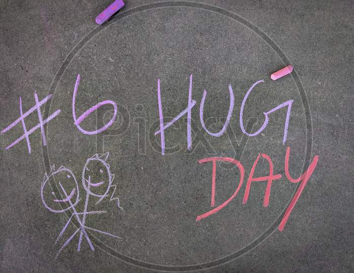 The Inscription Text On The Grey Board, #6 Hug Day With Hand Drawn Hugging Couple . Using Color Chalk Pieces. Valentines Week