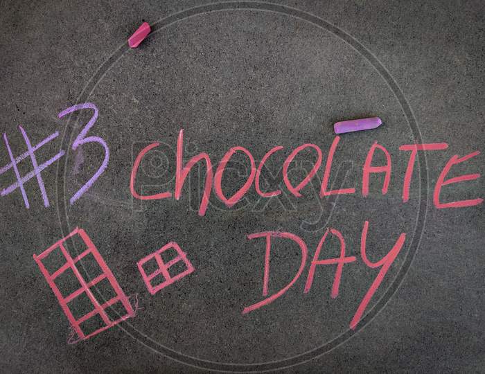 The Inscription Text On The Grey Board, #3 Chocolate Day With Hand Drawn Chocolates . Using Color Chalk Pieces. Valentines Week