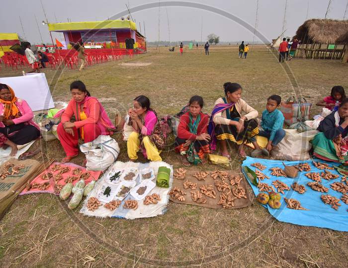 Women belonging to the Tiwa tribe display their merchandise as they wait to exchange them with the locals through a barter system as part of celebrations for Tiwa Bihu during Udpur festival near Dharamtul in Morigaon District of Assam ,india on Jan 19,2021