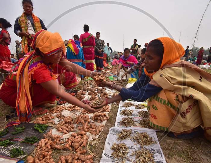 A tribal womane from the Tiwa community exchanges goods in the form of barter system during Udpur festival near Dharamtul in Morigaon District of Assam, India on Jan 19,2021