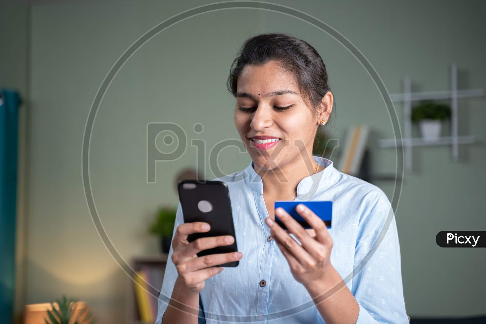 Young Indian Business Woman Entering Card Details On Mobile Phone For Online Purchase - Concept Of Digital Payment For Shopping, Internet Banking And Modern Technological Lifestyle.