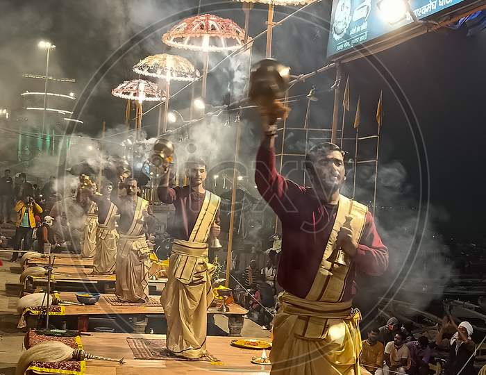 Varanasi, Uttar Pardesh, India 23 December 2020: Banaras Ganga Arti rituals at ganga ghat performed by Hindu priests assi ghat arti banaras Dashashwamedh Ghat Varanasi Kashi Vishwanath