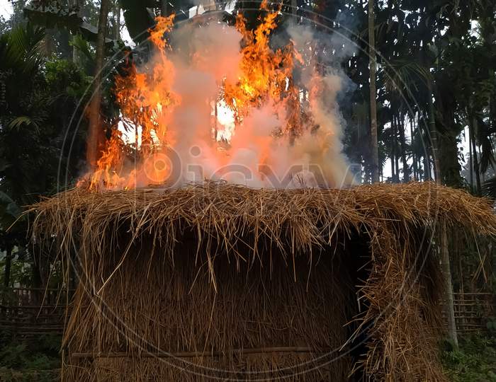 Flame on a straw hut in an assam village