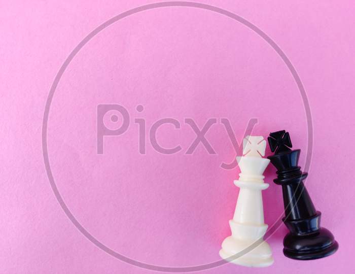 Copy Space Of Black And White Chess King Isolated On Pink Background. Joining Hands Concept