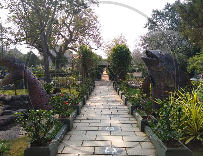 Beautiful fish sculpture and stone paved pathway situated at Thiruvananthapuram aquarium