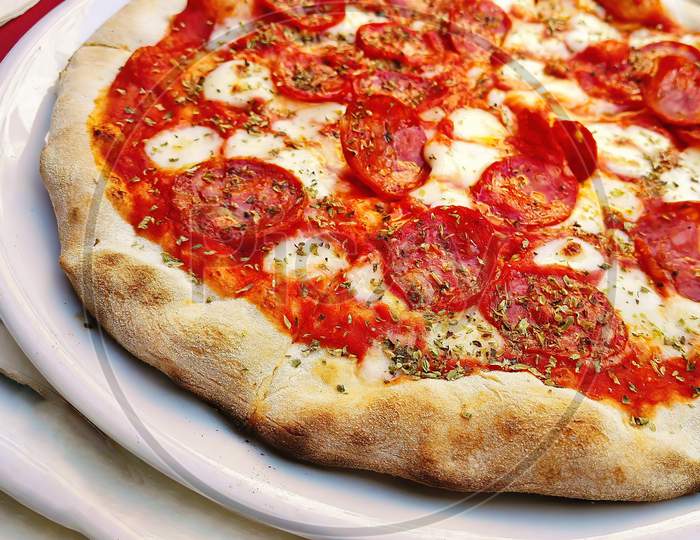 Closeup Macro Shot Of An Italian Pizza With Cheese And Oregano