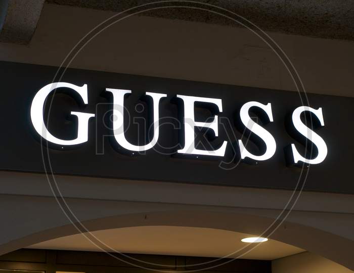 Luminous Guess Store Sign Hanging In Lugano