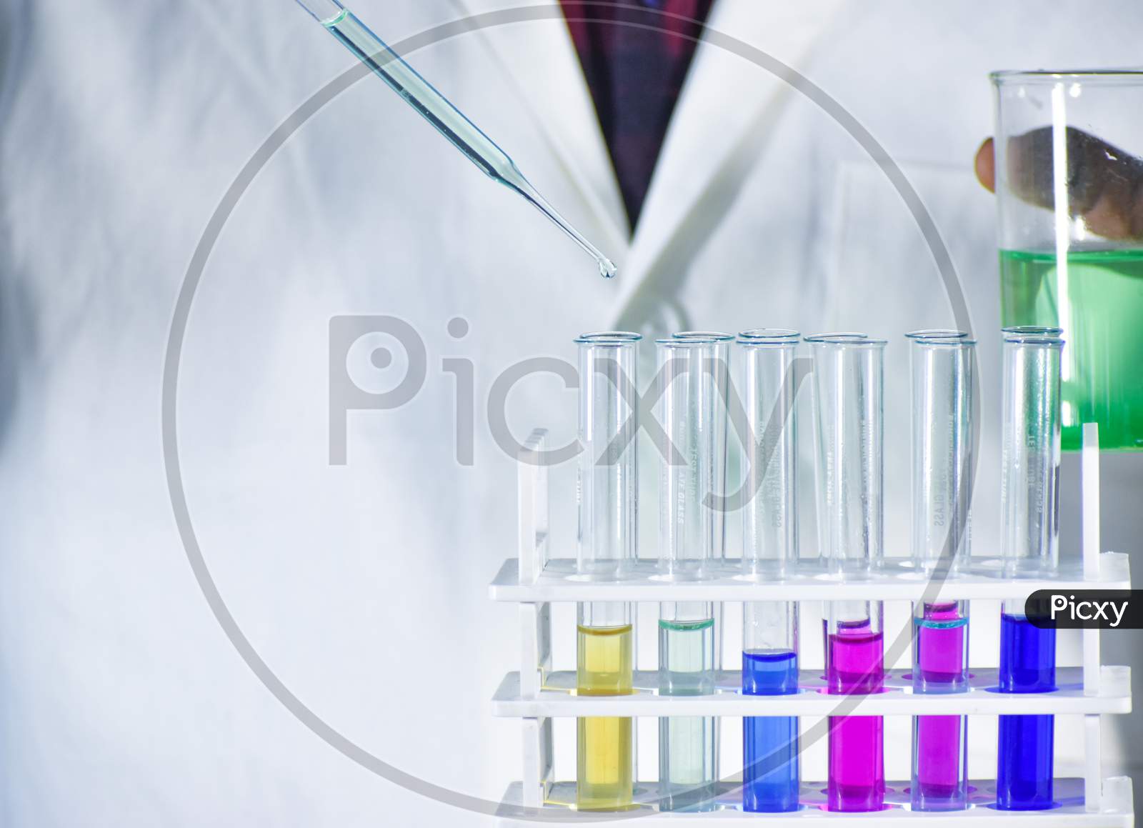 Scientist Taking Color Solution In A Test Tube