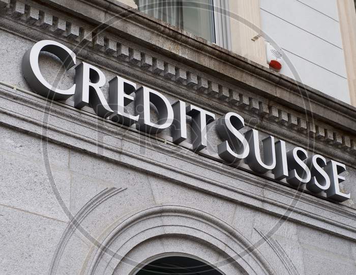 Credit Suisse Bank Sign Hanging On A Old Building Facade