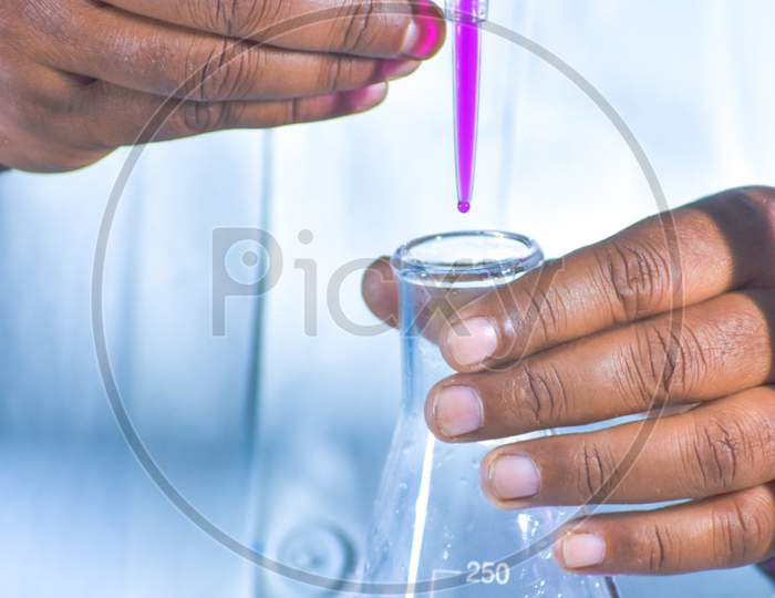 Titration With Color Solution In Chemistry Lab