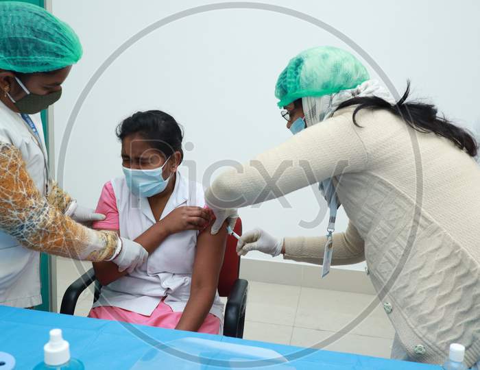 January 16 2021, Kishanganj, Bihar, India. A Nursing Staff Wearing A Mask Undergoing Covishield Vaccination Against Covid 19 At Mgm Medical College, Kishaganj, Bihar