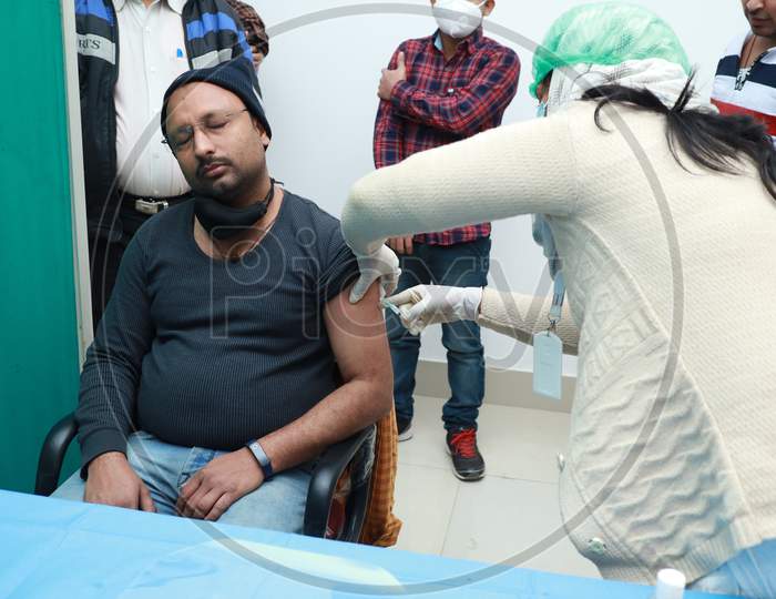 January 16 2021, Kishanganj, Bihar, India. A Health Worker Staff Wearing A Mask Undergoing Covishield Vaccination Against Covid 19 At Mgm Medical College, Kishaganj, Bihar