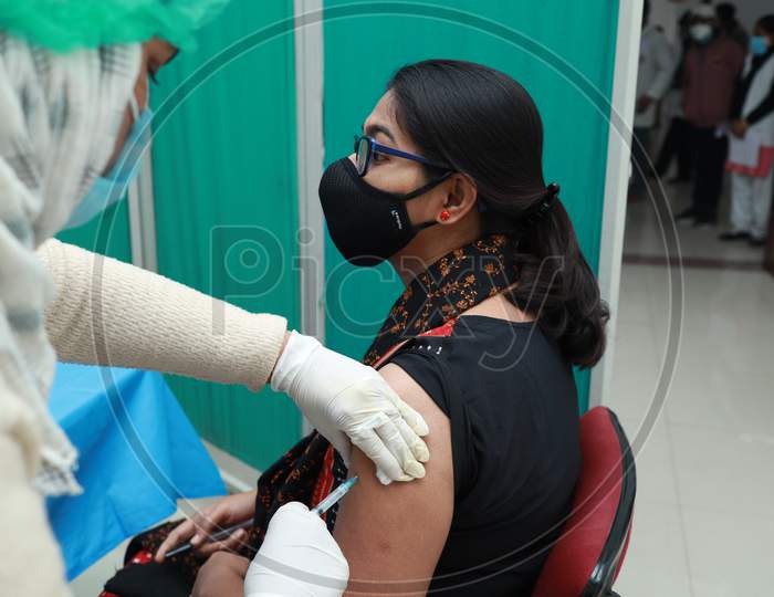 January 16 2021, Kishanganj, Bihar, India. A Lady Wearing A Mask Undergoing Covishield Vaccination Against Covid 19 At Mgm Medical College, Kishaganj, Bihar