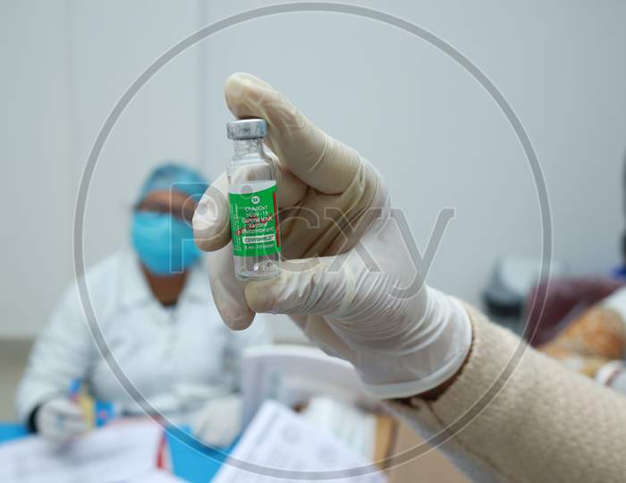 January 16 2021, Kishanganj, Bihar, India. A Nursing Staff Displaying Covishield Vaccine In Gloved Hand Preparing For Vaccination Against Covid 19 At Mgm Medical College, Kishaganj, Bihar