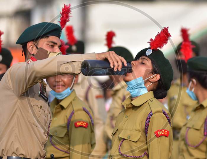 A cadet of the National Cadets Corp (NCC)  takes a drink during the full dress rehearsals for the Republic Day parade in Nagaon District of Assam on Jan 24,2021