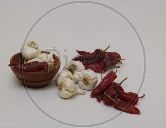 Red pepper chilli garlic pattern on white background isolation.hot chilli and garlic high res image.
