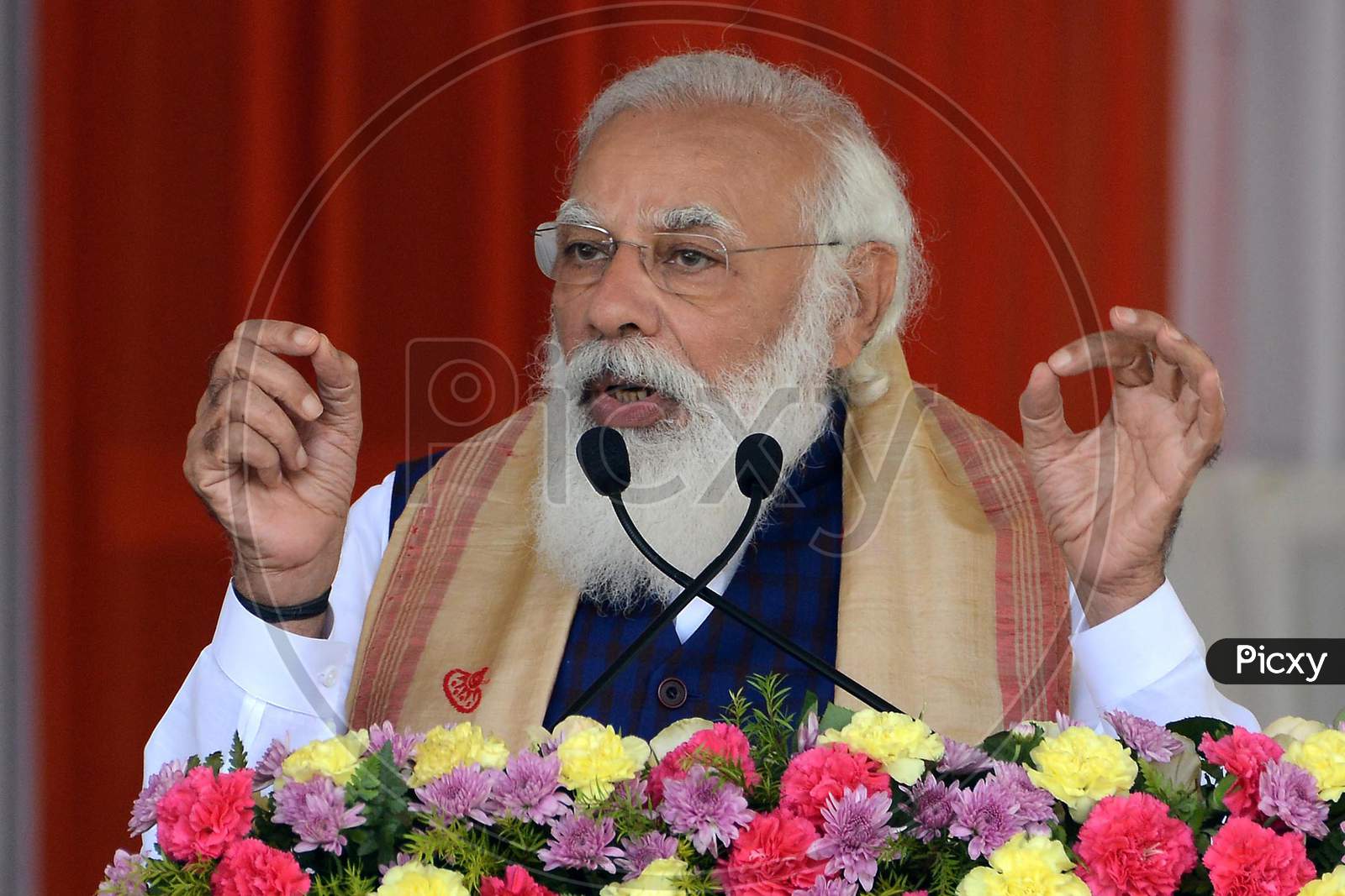 prime Minister Narendra Modi delivers a speech  during a public meeting, at Jerenga Pathar in Sivasagar District of Assam on Jan 23,2021