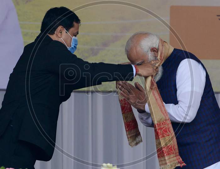 Indian  Prime Minister Narendra Modi  felicitated by Assam CM Sarabananda Sonowalduring a public meeting, at Jerenga Pathar in Sivasagar  District of Assam on Jan 23,3021