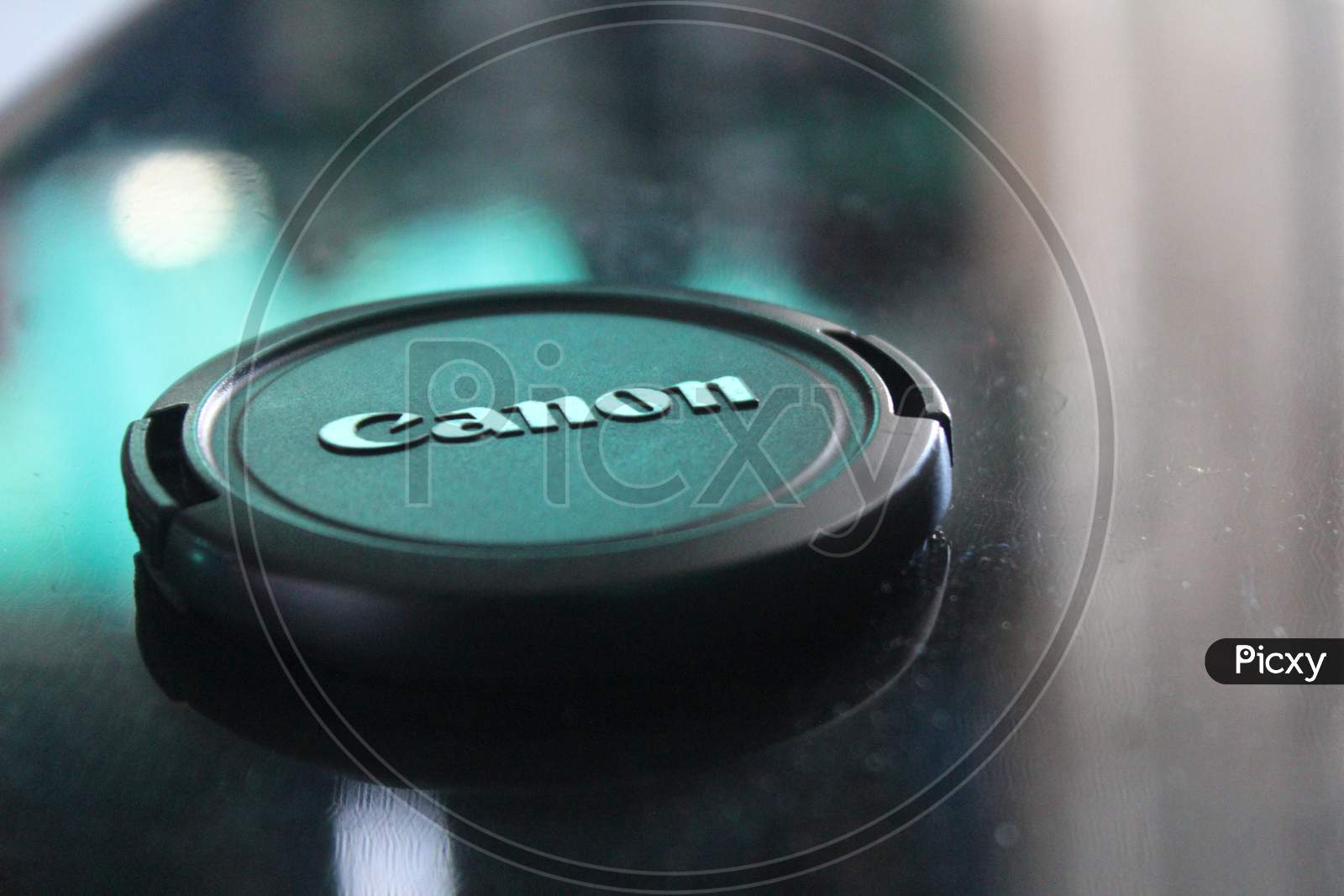 Canon camera lens cap close up view. Canon