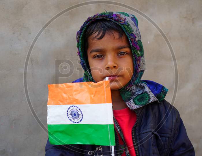 Ecstasy Boy With Great Indian Flag. Patriot Little Kid Affection With Tricolor Flag Or Tringa.