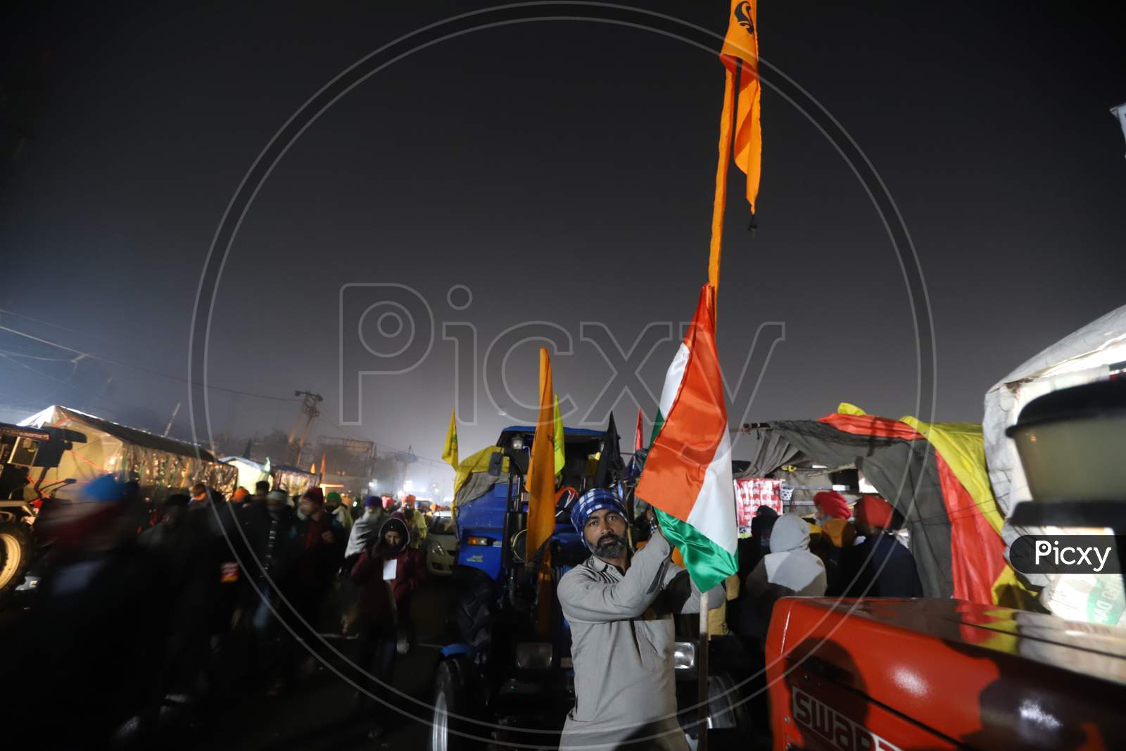 Farmers gearing up for Republic Day tractor rally as a part of the ongoing agitation against new farm laws at Singhu Border, near New Delhi, India on January 25, 2021.